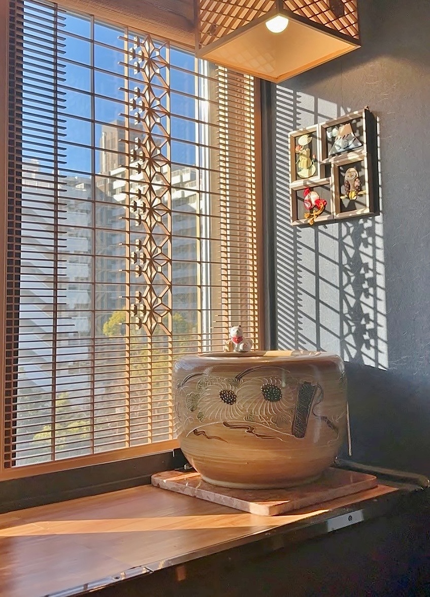 Close-up of a kumiko wooden lattice with light and shadow on the joints